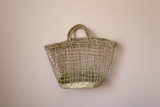 Grocery Basket with plaster pink background